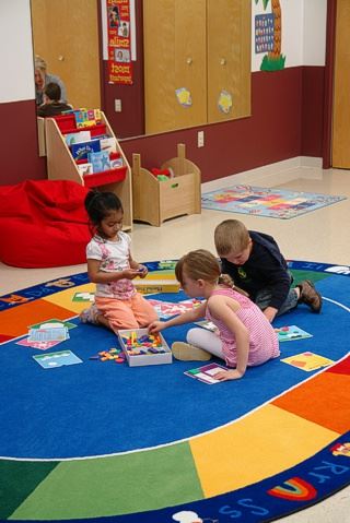 Children playing on a rug